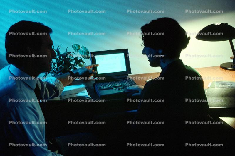 Man and Woman at Computer, Monitor, Laptop