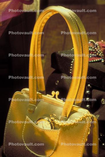 Pocket Watch chained to a golden purse