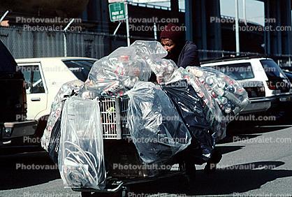 crosswalk, Homeless woman with a cart full of recyclable waste