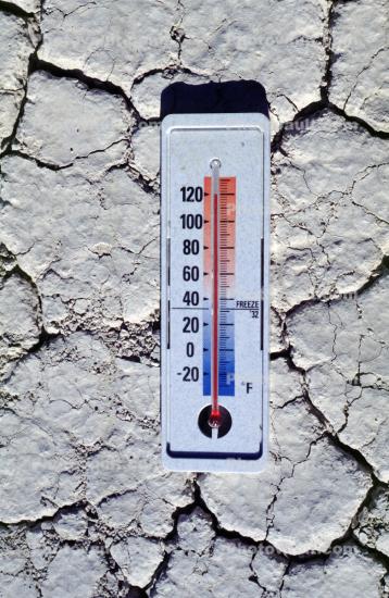 Thermometer with sun baked earth