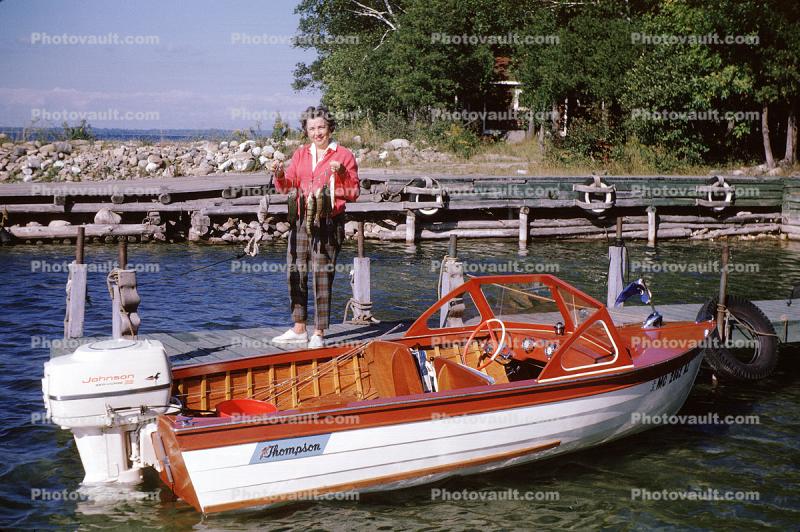Woman with her Thompsen Motorboat, Johnson Outboard Motor, 1950s