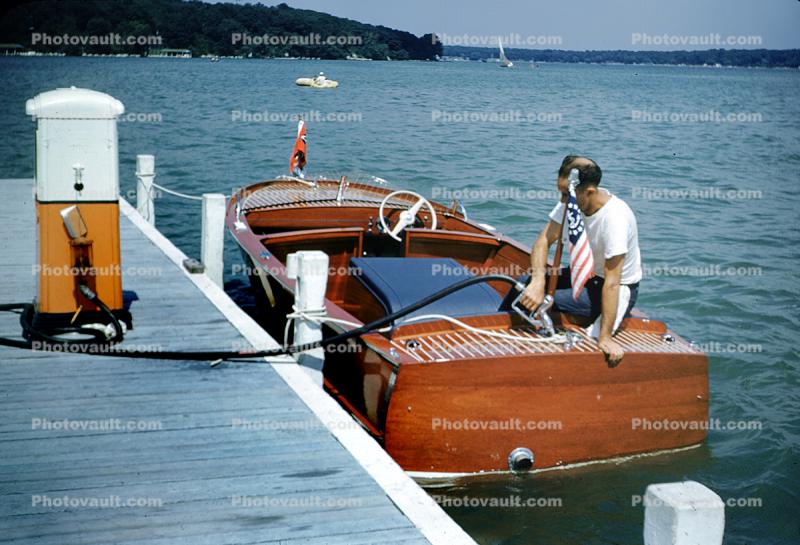 Man Fueling Old Powerboat, Dock, Fuel Pump, Hose, 1950s