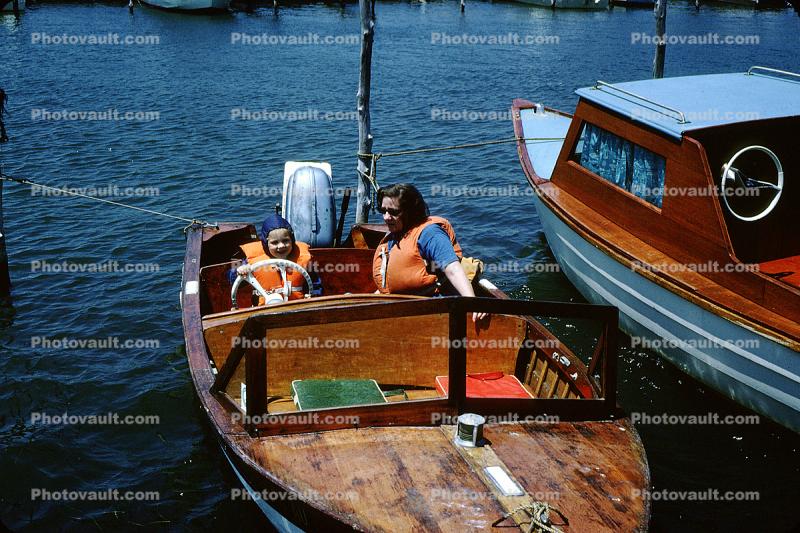 Mother with Daughter wearing lifevests, powerboat, cute, 1950s