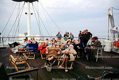 Relaxing on Deck, Fur Coats, sleeping, women, deck chairs, cold, 1950s