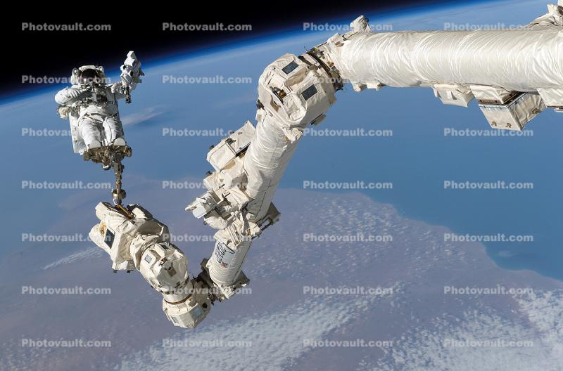 Astronaut anchored to a foot restraint on the Canadarm2, ISS
