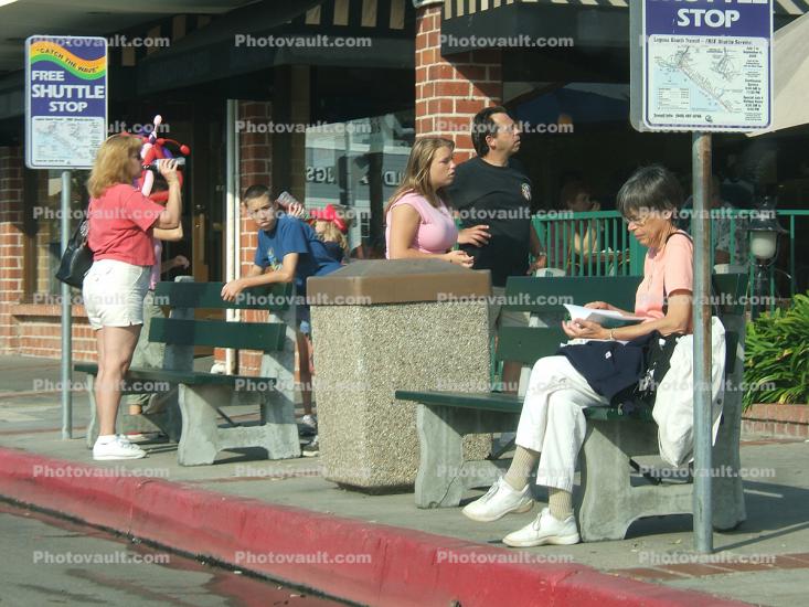 People at a Bus Stop, Laguna Beach, California, curb, benches