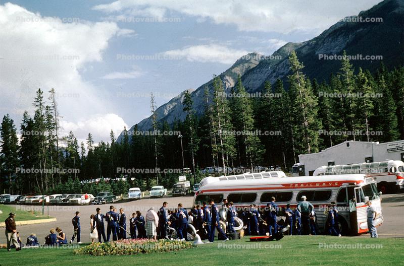 Passengers, Band Boarding Bus, Trailways Bus, cars, automobiles, vehicles, Banff, Alberta, Canada, 1962, 1960s