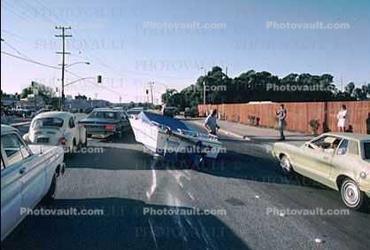 Boat skidding down the road
