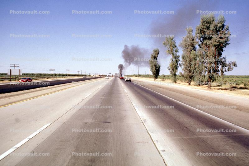 Station Wagon on Fire, smoke, highway