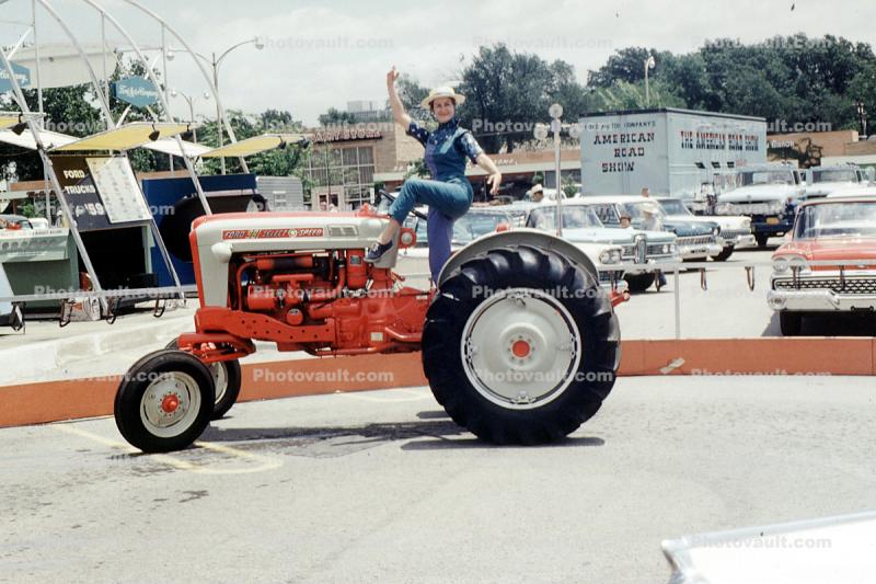 Ford 981 Select Speed, Ford Motor Company Road Show, woman posing on a tractor, December 1959, 1950s