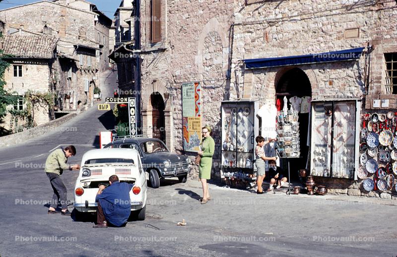 Street scene, buildings, car, Assisi Italy, minicar, Fiat mini-car, October 1969, 1960s