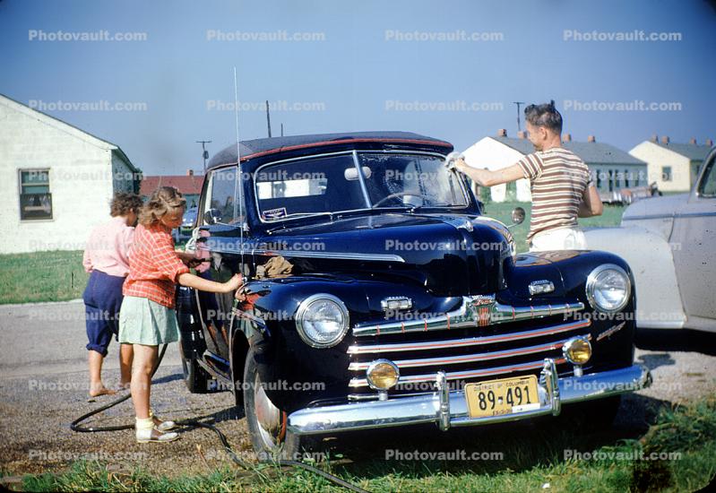 Family Washing the car, Ford Sedan, cabriolet, convertible, chrome grill, headlamps, girl, man, woman, 1950s