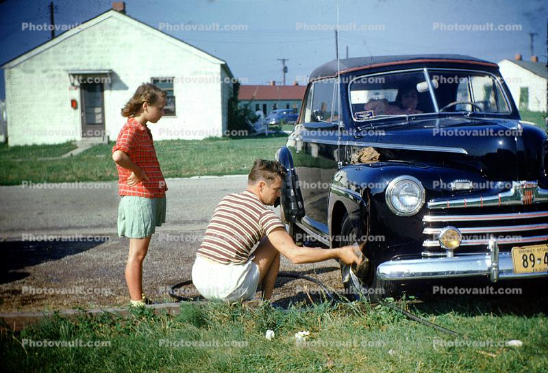 Ford Sedan, cabriolet, convertible, chrome grill, headlamps, girl, man, woman, 1950s