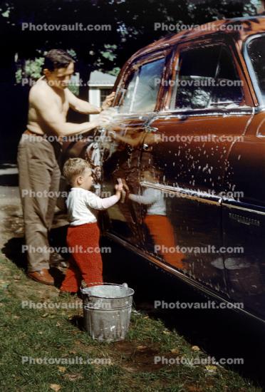 Father and Son Washing Car, 1950s