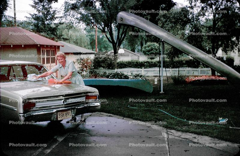 Woman Washing a Buick Car, Vehicle, Automobile, 1960s