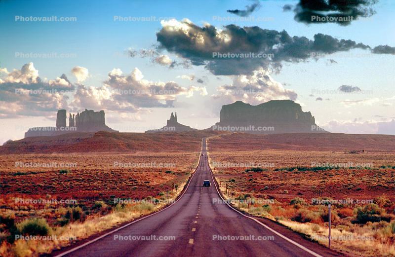 Monument Valley, road, Highway 163, vanishing point, butte, mesa, clouds