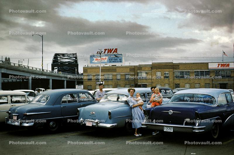 Buick, Chevy, Ford, TWA Billboard, Parked Cars, Women, babies, Car, Automobile, 1950s
