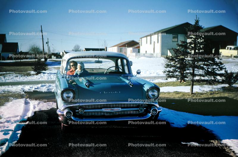 1956 Chevy Bel Air, Car, Automobile, Woman with Baby, cold, snow, ice, driveway, 1950s