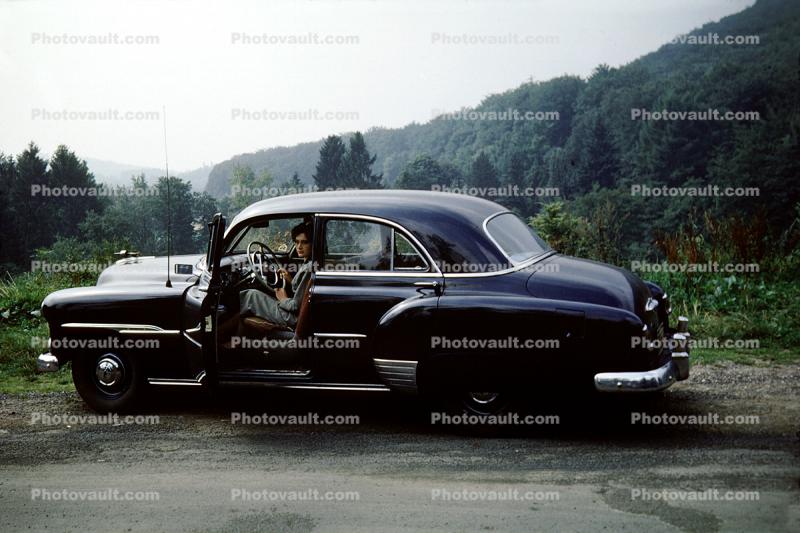 Chevy four-door sedan, Car, Woman, 1940s