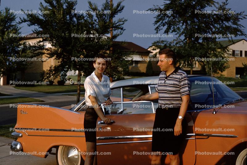 Plymouth Belvedere, Woman, Man, tail fins, suburbia, 1950s