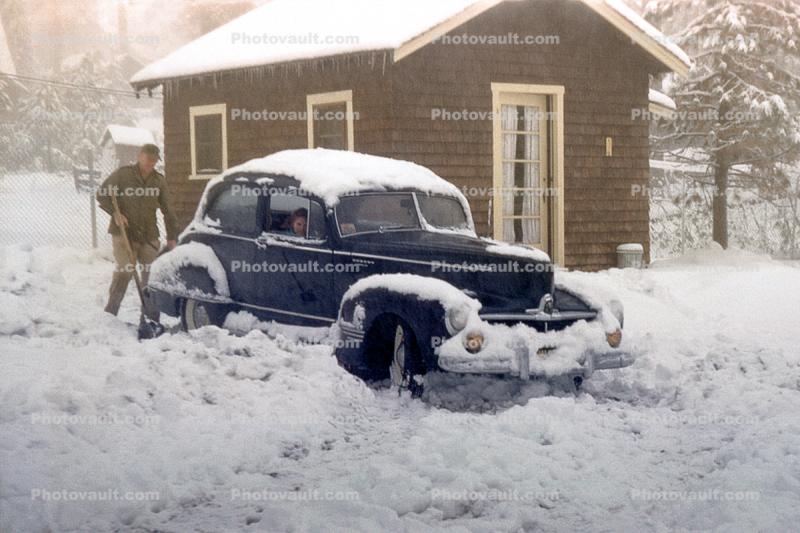 1941 two-door coupe, Snow, Ice, Cold, man shoveling snow, cottage, Big Bear California, 1940s