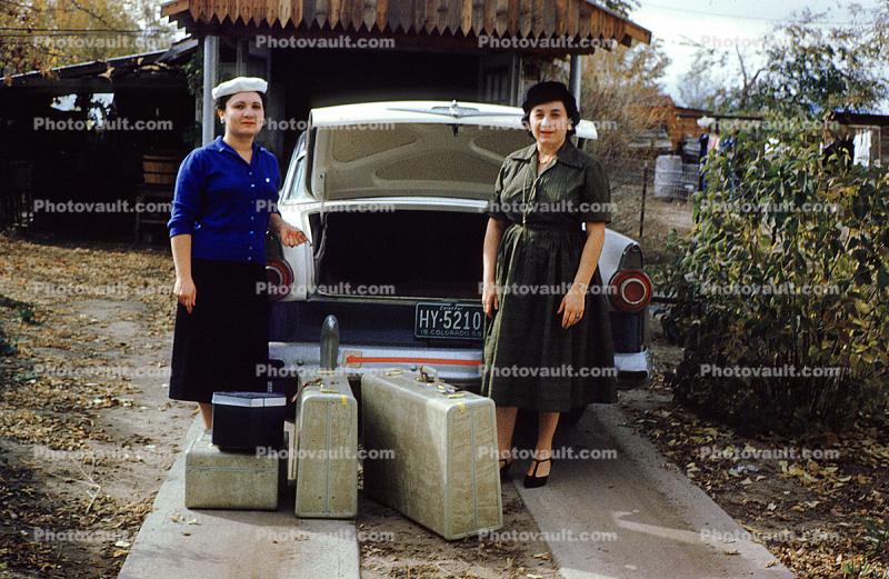 Women Packing Suitcases, luggage, Ford Customline, 1950s
