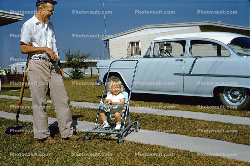 Girl in a Stroller, 1956 Chevy Bel Air, Father, Daughter, shovel, 1950s