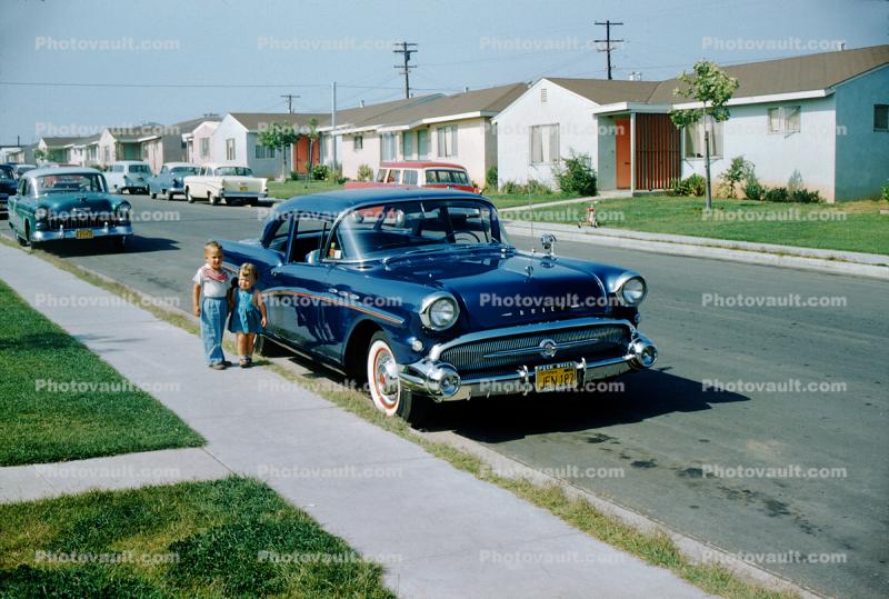 Boy, Girl, 1956 Buick, Homes, houses, street, Sidewalk, 1950s