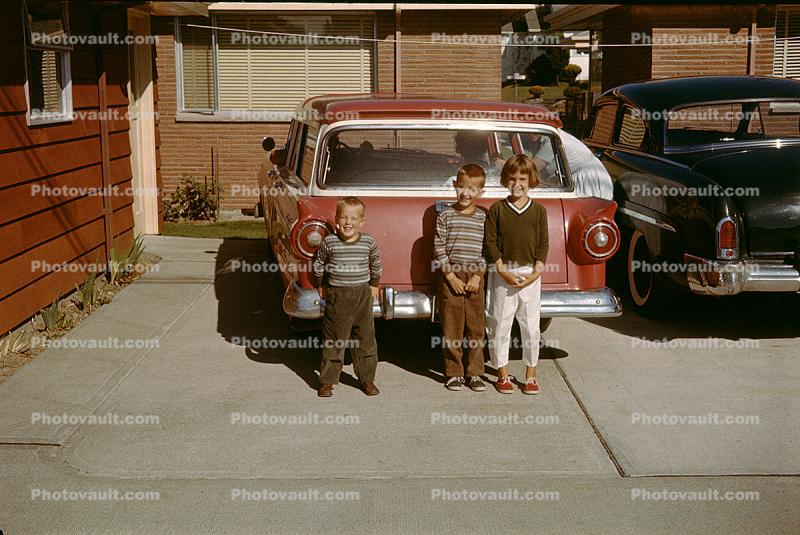 Children Stand in front of a 1957 Ford Ranch Wagon, 1950s