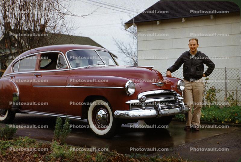 Man with his Chevrolet Deluxe, sedan, 1950s