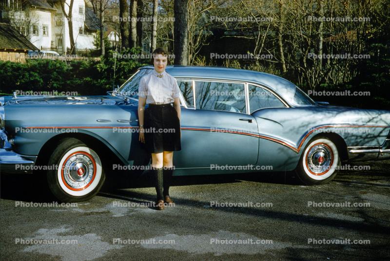 Woman in front of her Oldsmobile