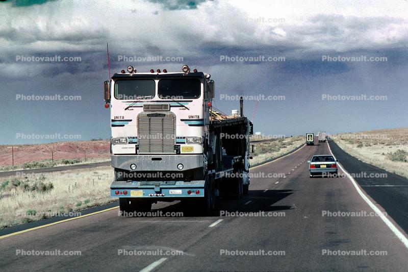 Freightliner, Interstate Highway I-40 looking west, flatbed trailer, cabover semi trailer truck, flat front