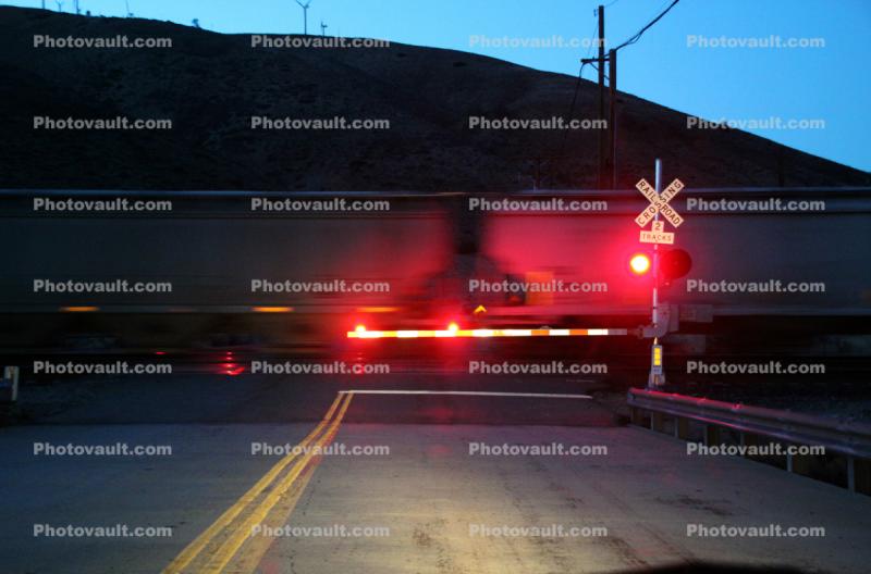Railroad Crossing Gate, lights, early morning, hopper railcar