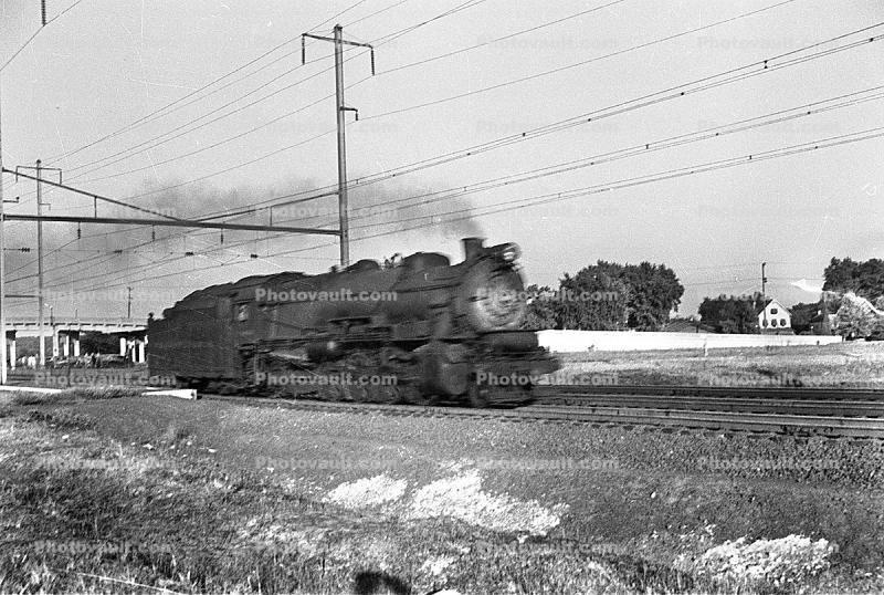streaking steam locomotive, 1950s