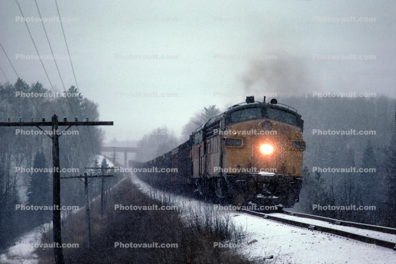 Milwaukee Road MILW F7A, 109A, 108A, Train Rumbles in the Snow, north of Iron Mountain Minnesota, sleet, F-unit