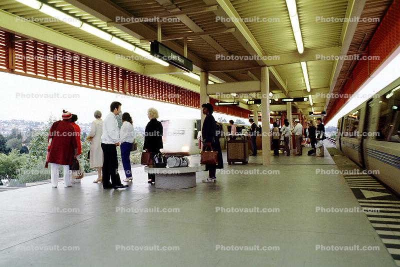 Passengers waiting for BART, train platform, people, morning, platform, station, commuters