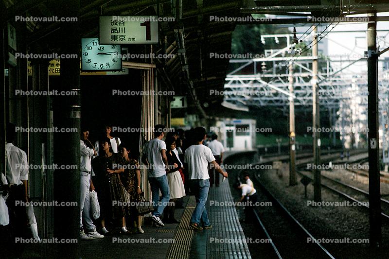 Train Station, crowds, waiting passengers, commuters, platform, clock