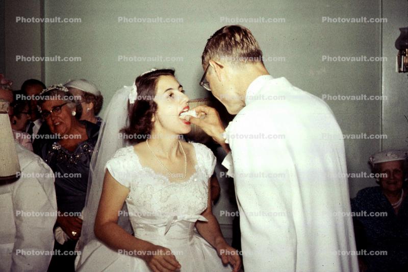 Bride and Groom eating cake, 1950s