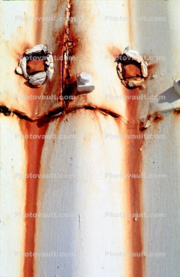 Sad Rust Face, Corrugated metal, rusty, eyes, mouth, nose, tearing rusty, sad, tears, rivet nose, bolt eyes, drippy, Pareidolia