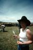 inoculating a calf, Cowgirl, Hat, Branding, Calf, ACFV02P07_06