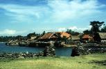 harbor, stone walls, grass thatched huts, homes, houses, roofs, building, Sod