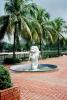 Lion Statue Fountain, palm trees, brick path