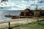 Dock, boats, Cabins, footpath, buildings, beach, sand, fence, God's Lake Lodge, Manitoba, Canada, CCMV01P02_04