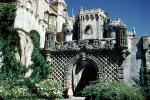 Entrance gate to Pena National Palace, Castle, building, woman, gardens, Sintra, CEPV02P02_12