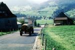 Water Truck, farm fields, buildings, barn, road, Switzerland, CESV02P10_17