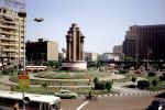 Monument, Roundabout, Cairo, cars, buses, buildings, CJEV03P08_01