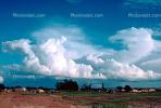 Cumulonimbus Clouds, village, buildings, houses, Fada-Ngourma, Gourma province, CJFV01P02_15.1041