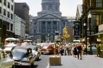 Downtown Indianapolis, cars, crowds, stores, Greyhound Bus Station, 1950s