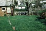 Backyard, lawn, walkway, stepping stones, fence, wall, home, house, CLOV02P09_06