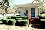 Elvis Presley Birthplace, porch, trimmed shrubs, manicured garden, Tupelo, famous landmark, CMSV01P10_12